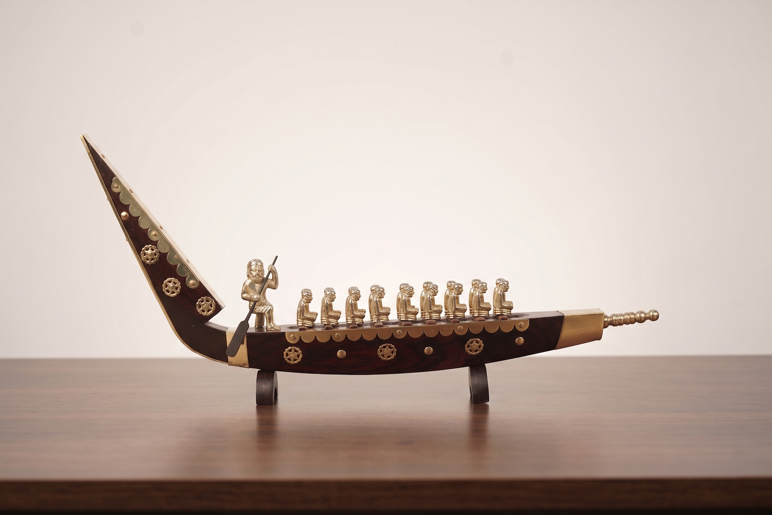 Snake boat with men brass